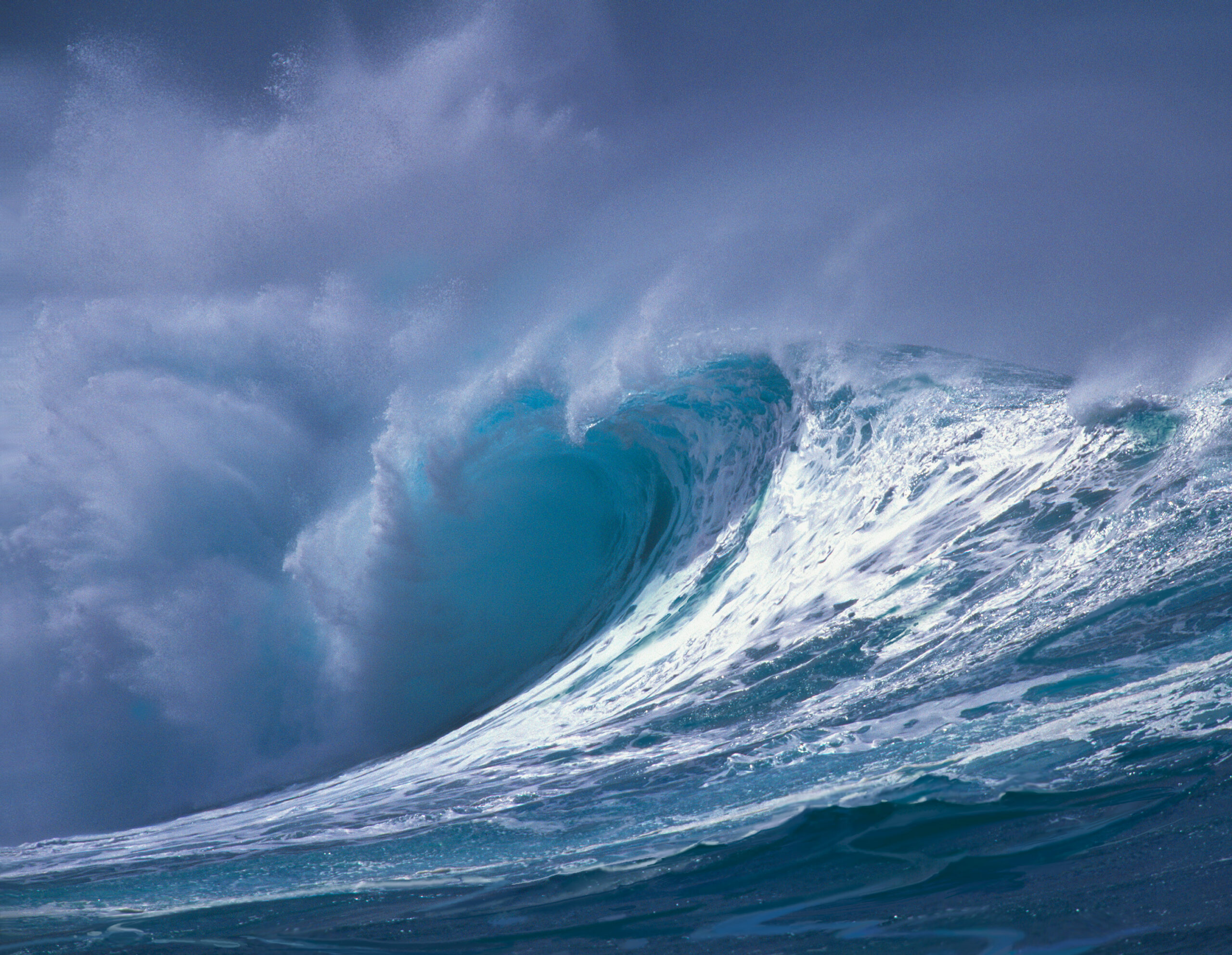 Sunset Beach by John Pitre featuring powerful ocean wave curling under dramatic sky, crashing surf with luminous crest, coastal fine art capturing motion, energy and natural force